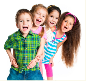 Four children smiling at camera