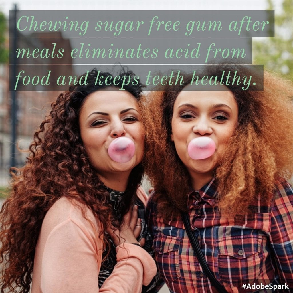 Two women chewing sugar free gum