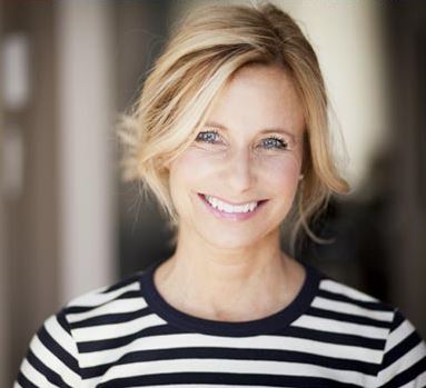 Photo of a middle-aged blonde woman smiling, for information on cosmetic dentistry despite sensitive teeth - from Lafayette, LA cosmetic dentist Dr. Mike Malone.