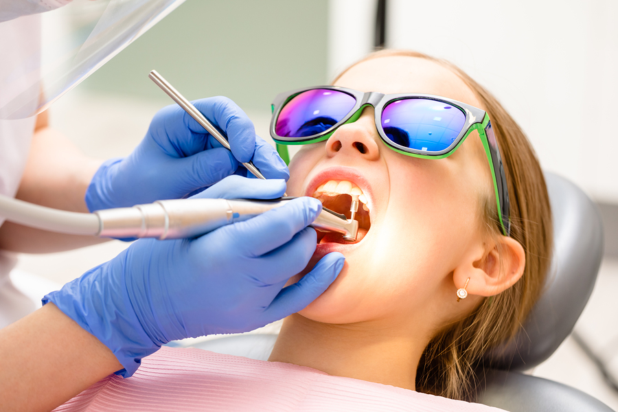 child getting teeth attended to